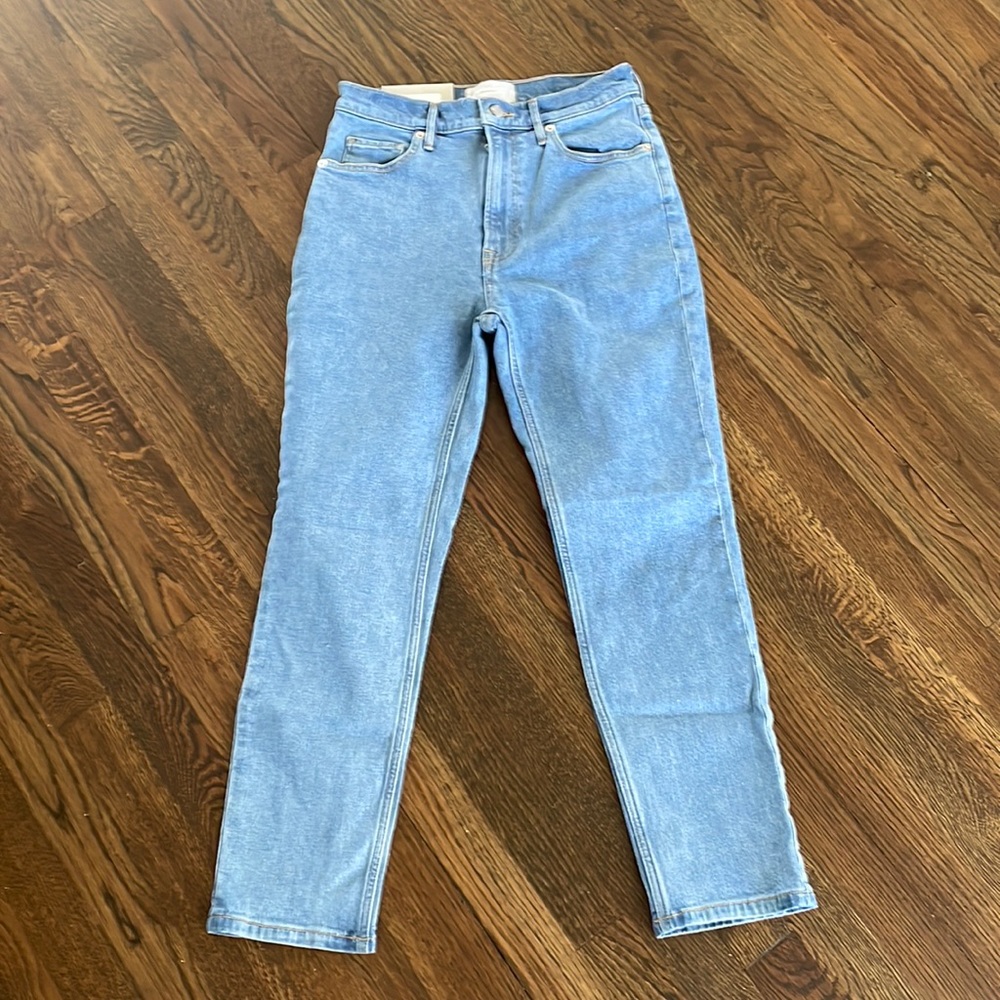 New - Slim straight leg. Slim fit through hips and thigh. Sits high at waist.